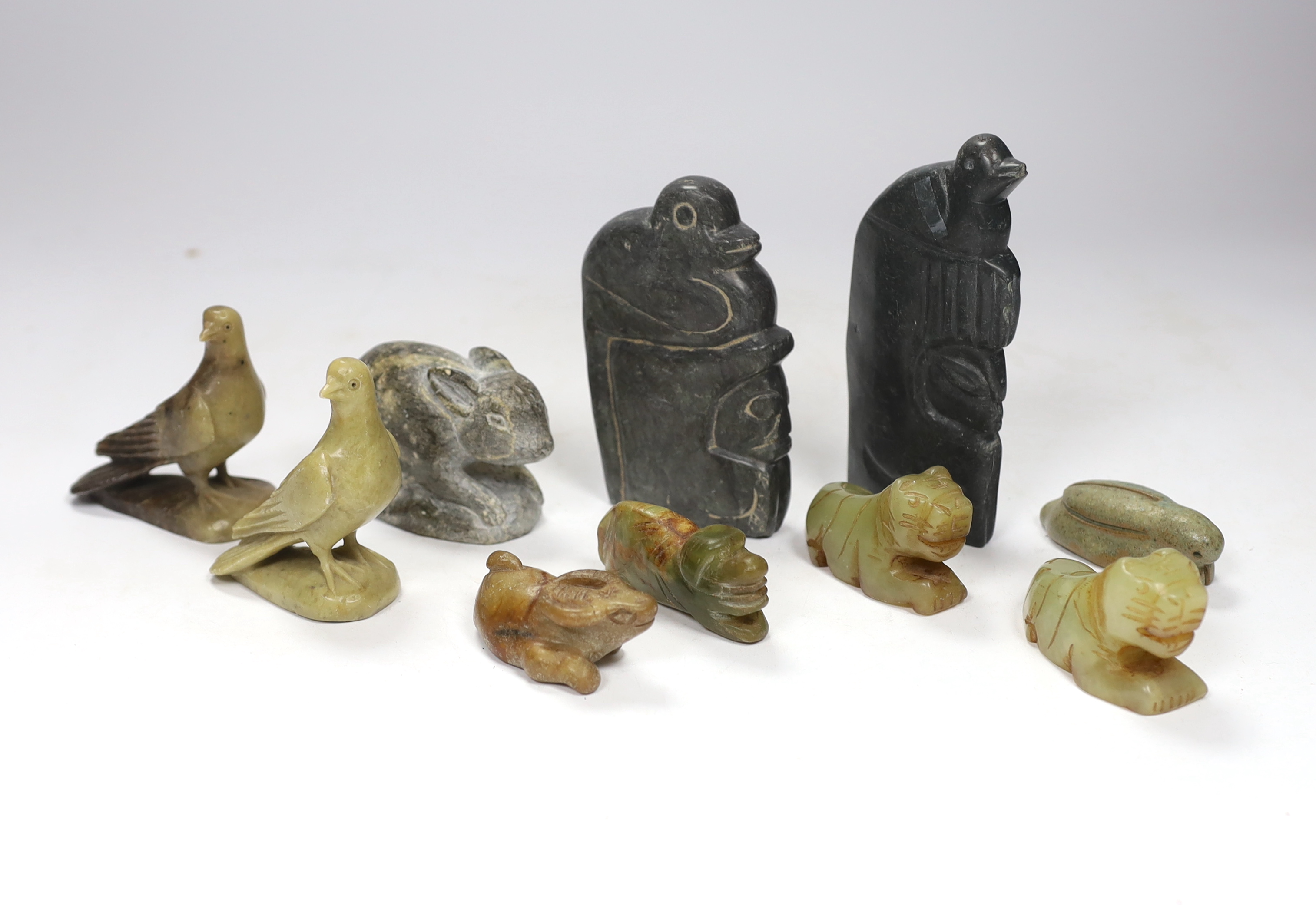 Ten hardstone carvings including Inuit examples, largest 14cm high